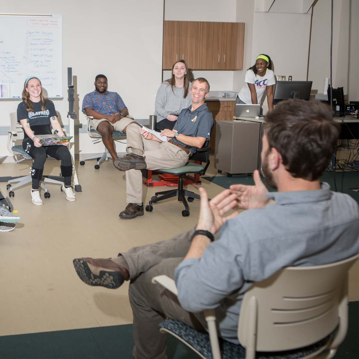 Group of students talking in a laboratory