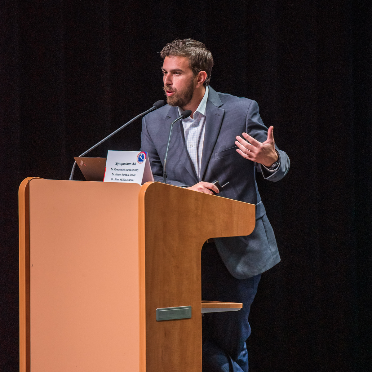 A speaker at a podium
